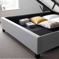 close up of the under bed storage on the Ashley Grey Ottoman Bed