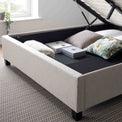 close up of the under bed storage on the Ashley Oatmeal Ottoman Bed
