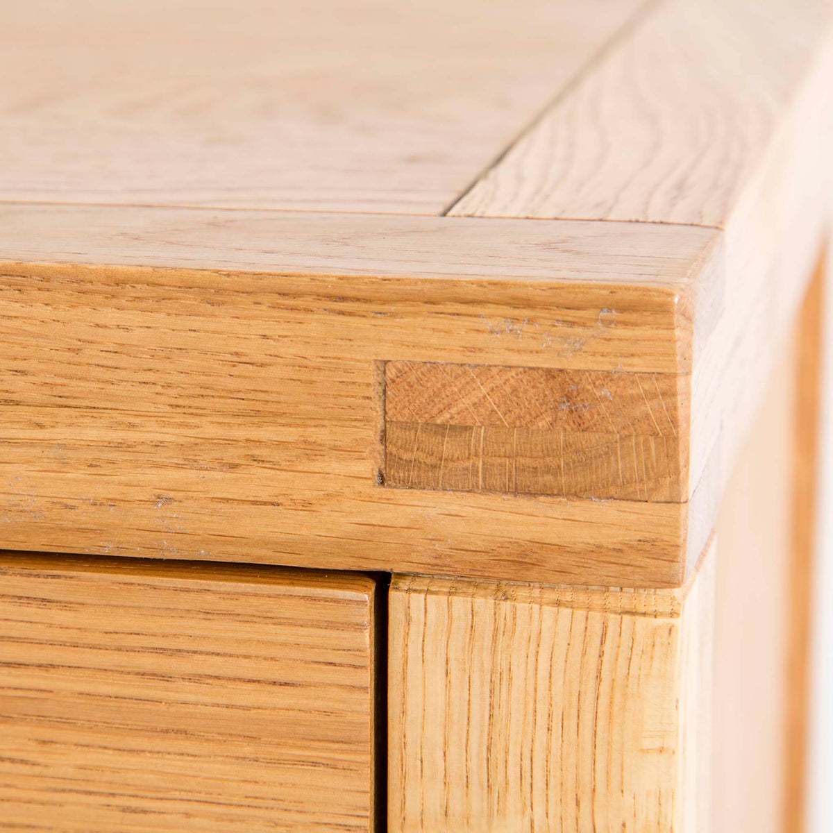 Abbey Waxed 3 Drawer Small Oak Bedside Table - Close up of corner tenon joint