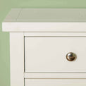 Close up of corner of The Cornish White Wooden 3 Drawer Bedside Table