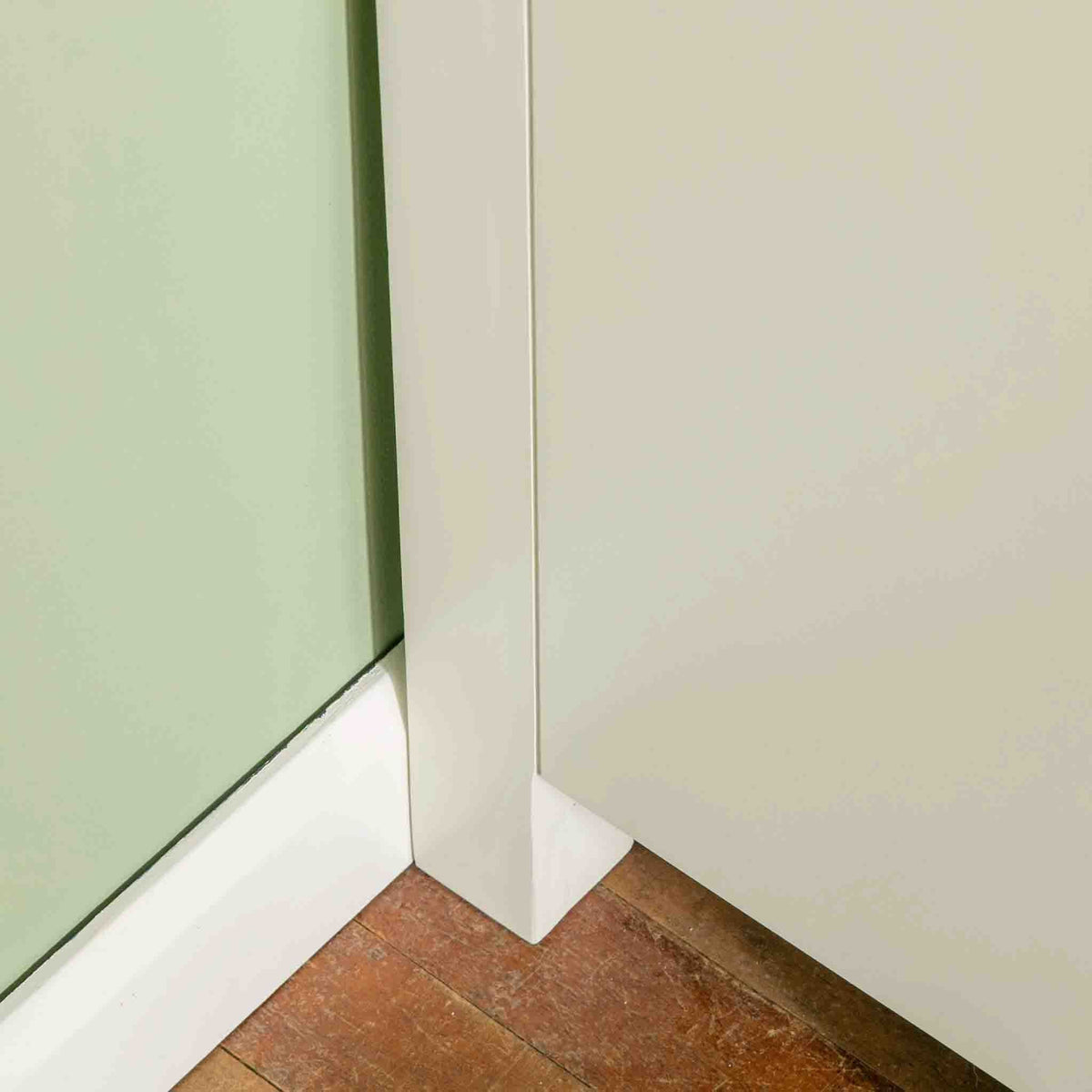 Close up of back leg on The Cornish White Wooden Chest of Drawers 