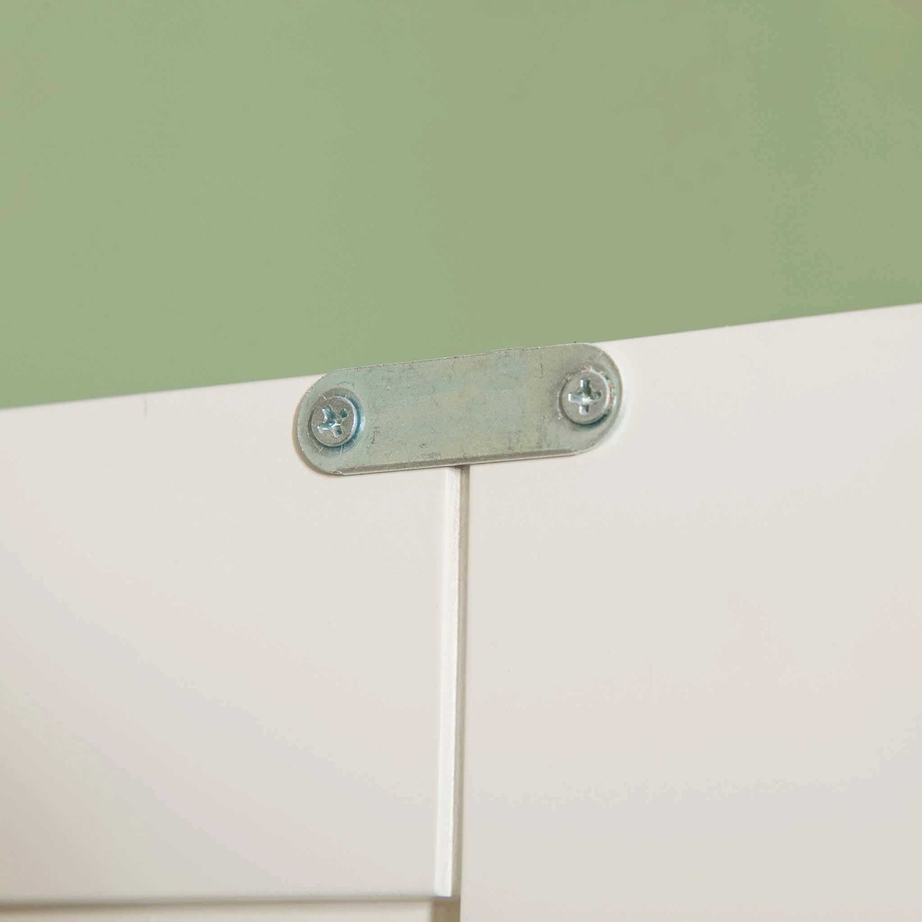 Close up of doors metal catch on The Cornish White Wooden Double Wardrobe