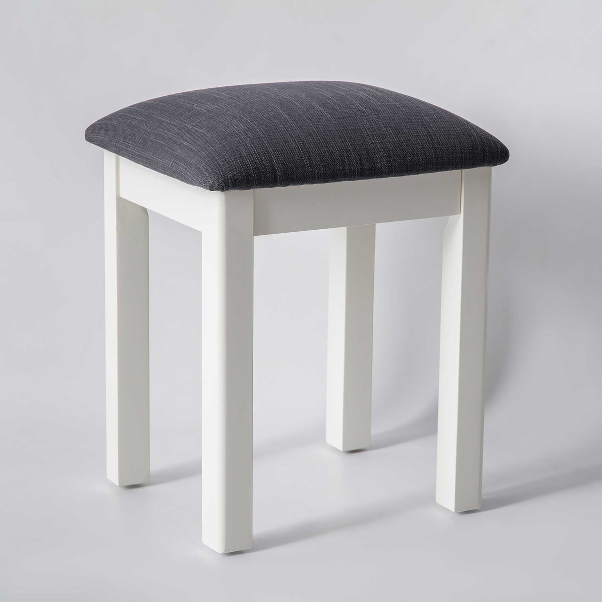 side view of the The Padstow White Wooden Dressing Stool with Padded Seat