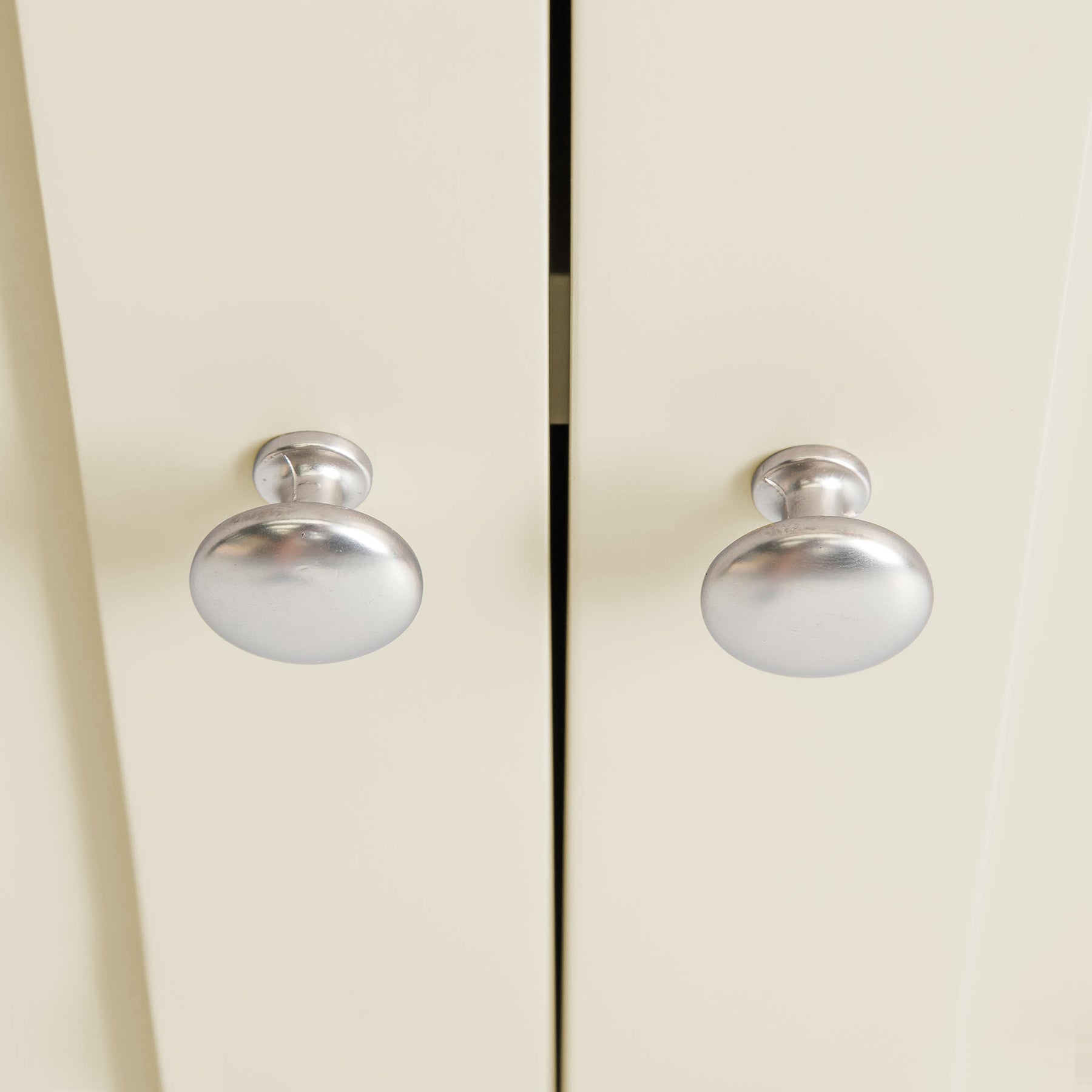 Farrow Cream Cupboard from Roseland Furniture - close up of silver handles