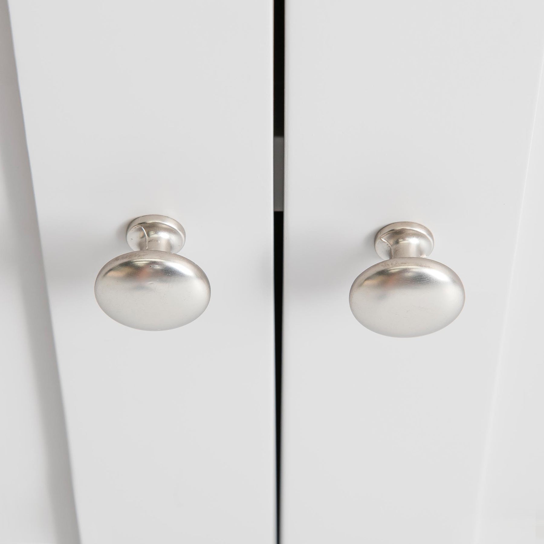 Farrow Grey Cupboard from Roseland Furniture - close up of silver knobs