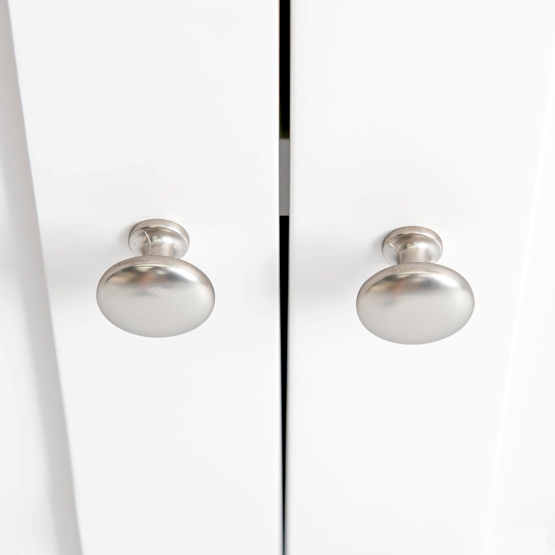 Farrow White Mini Cupboard from Roseland Furniture - close up of silver handles