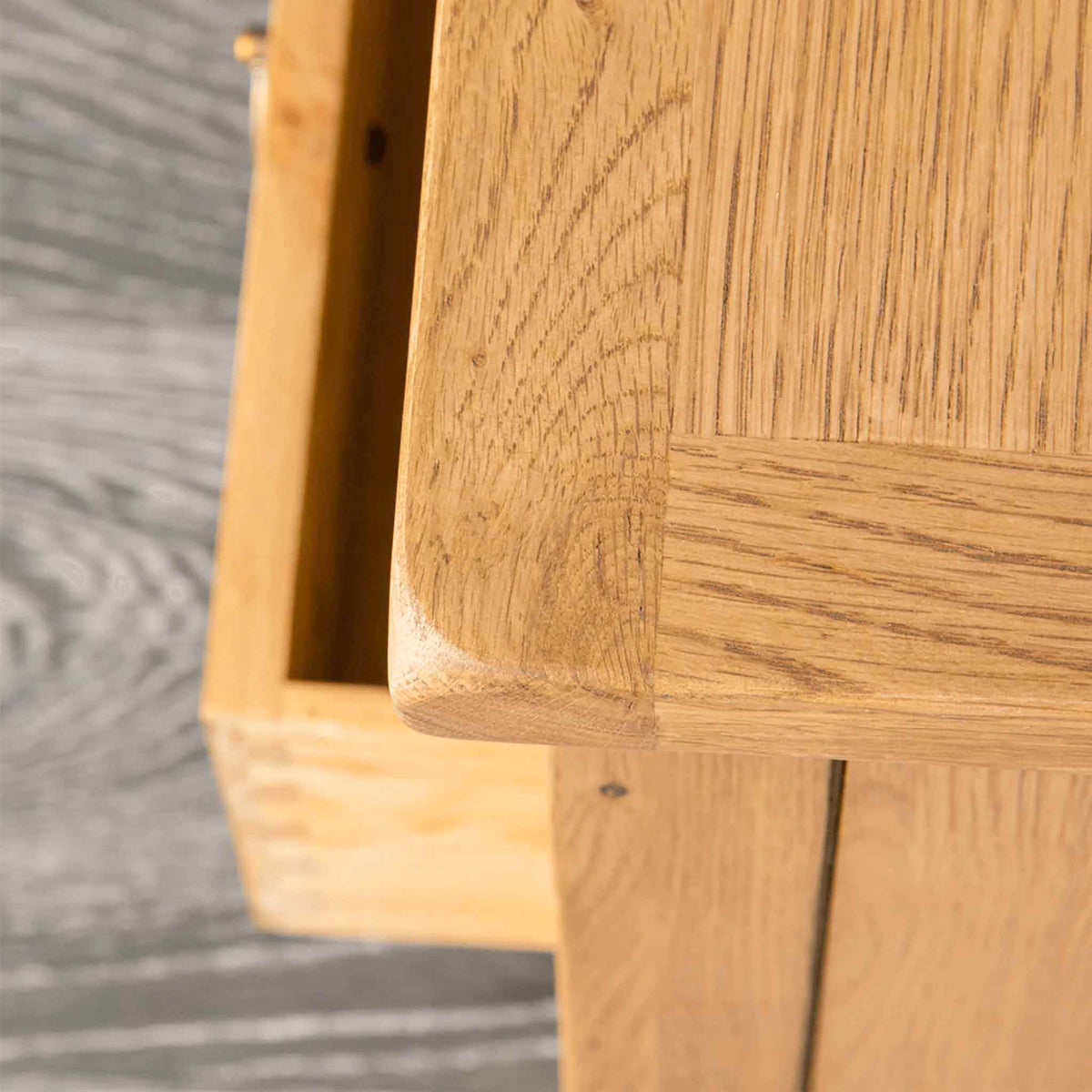 Surrey Oak waxed TV stand 90cm - Close up of top corner and lower drawer