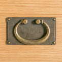 close up of brass drop handle