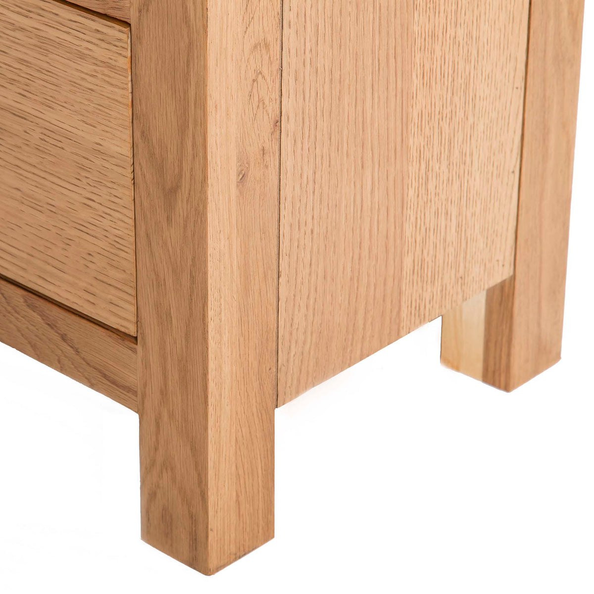 Surrey Oak 5 drawer tallboy chest of 5 drawers - Close up of  feet of tallboy