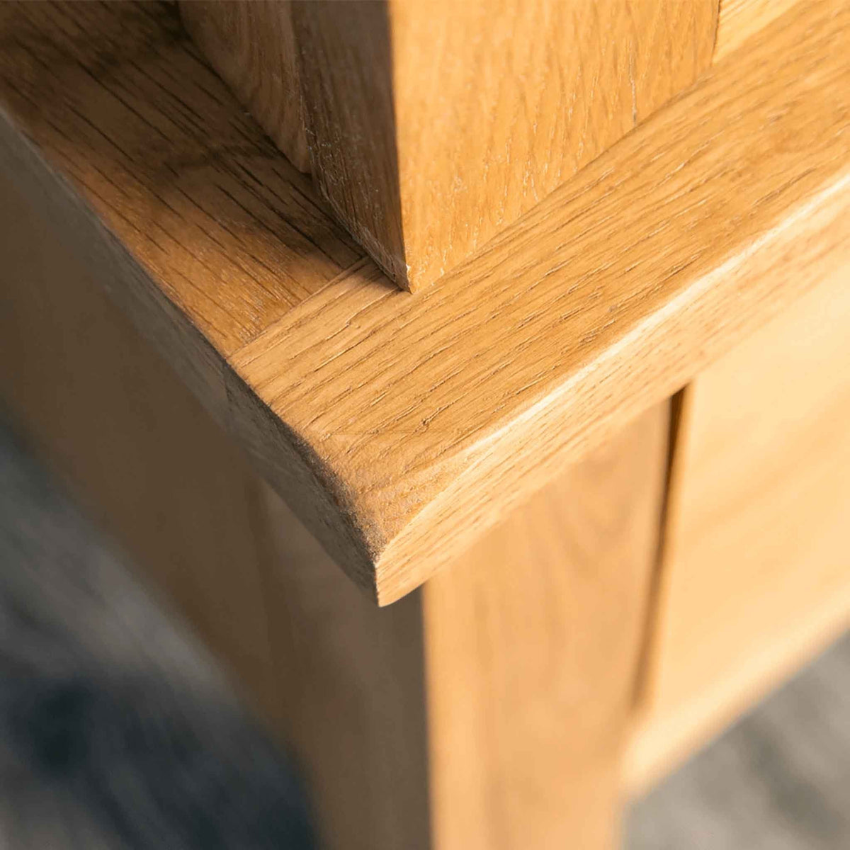 Corner closeup of Surrey Oak Triple Wardrobe & Drawers