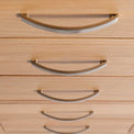 close up of the tiered metal handles on the London Oak Tallboy Chest