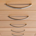 close up of the tiered metal handles on the London Oak Tallboy Chest