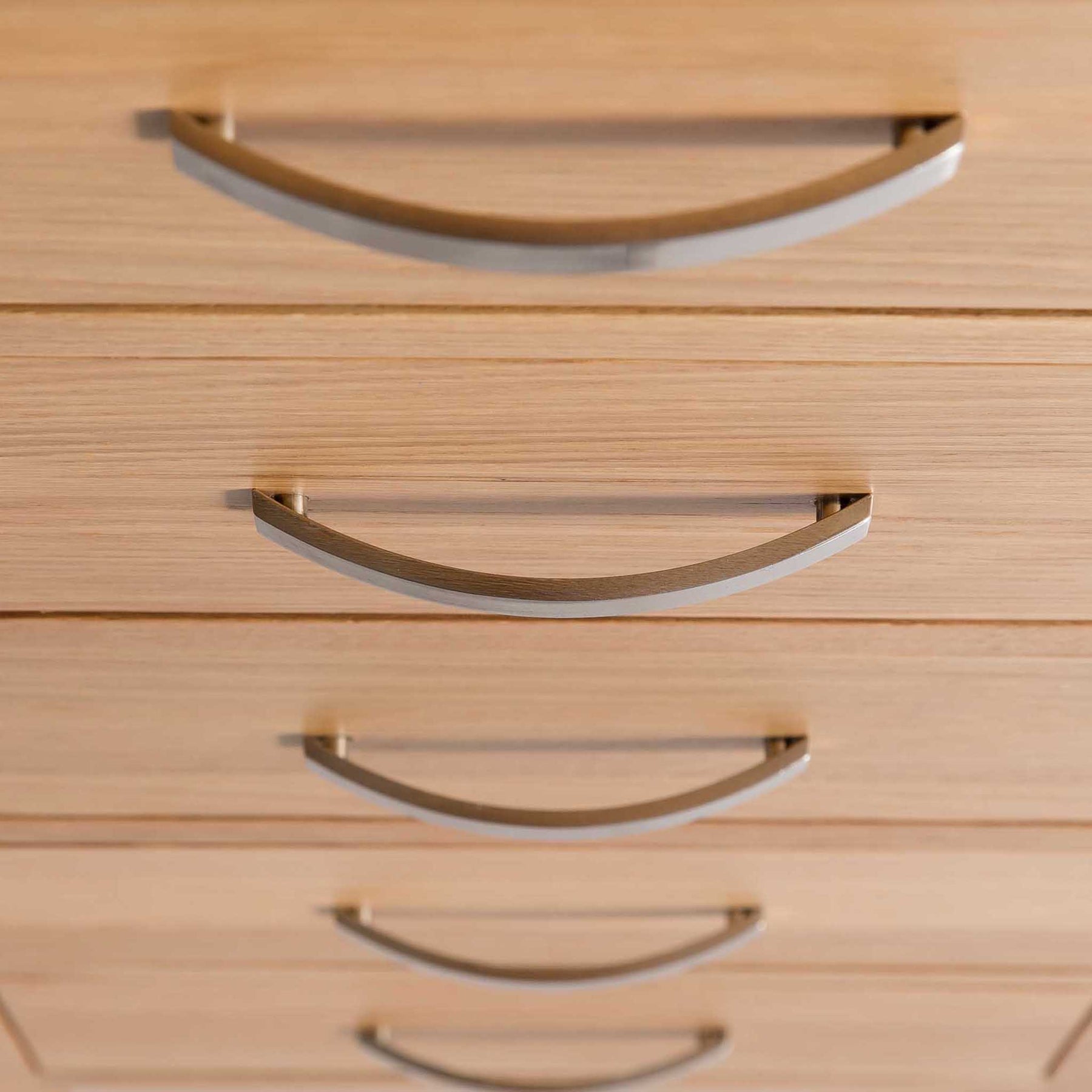 close up of the tiered metal handles on the London Oak Tallboy Chest