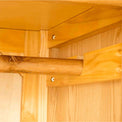 Wooden hanging rail in a Roseland Furniture gents wardrobe. 