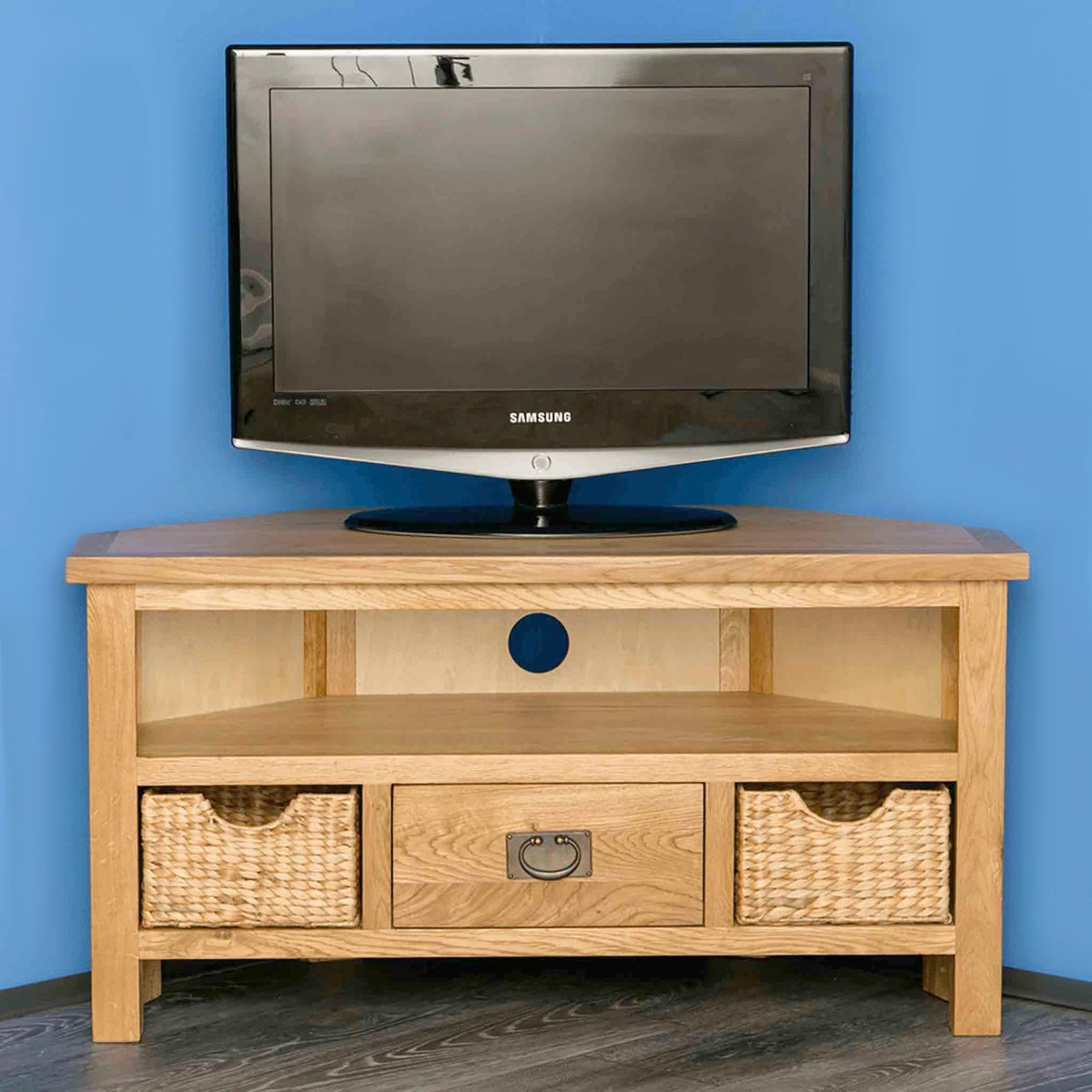Surrey Oak Corner TV Stand with Baskets by Roseland Furniture - Lifestyle front view