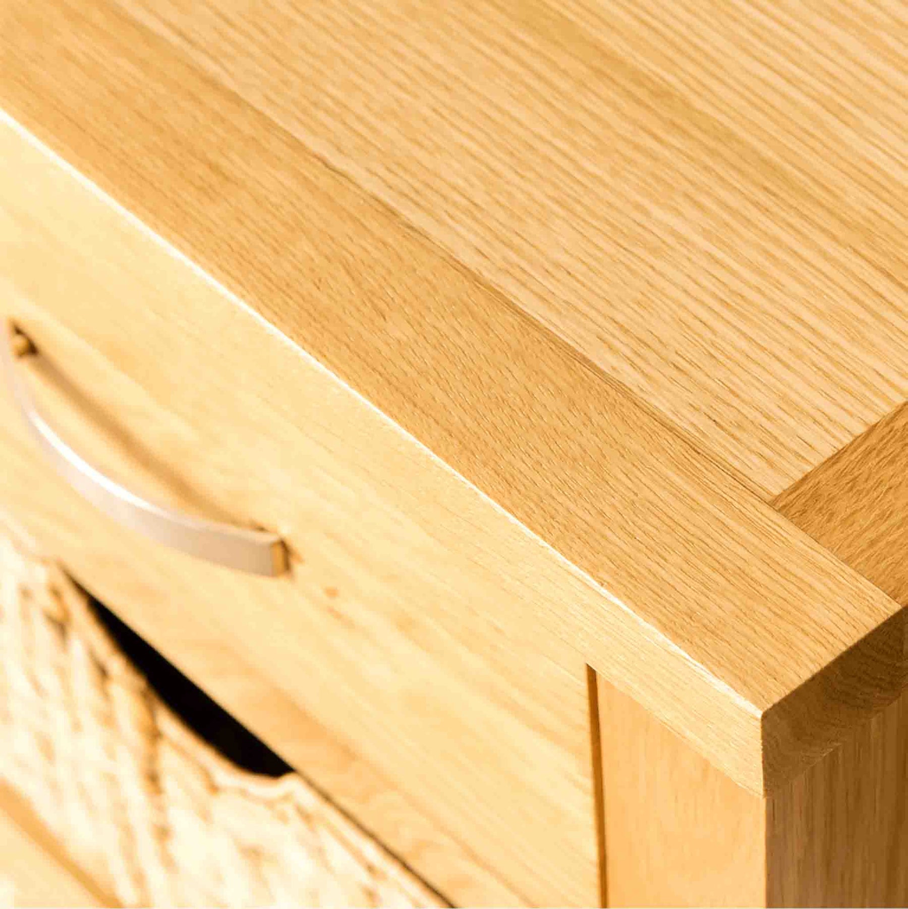 Close up of the top of a London Oak Console Table with baskets. 