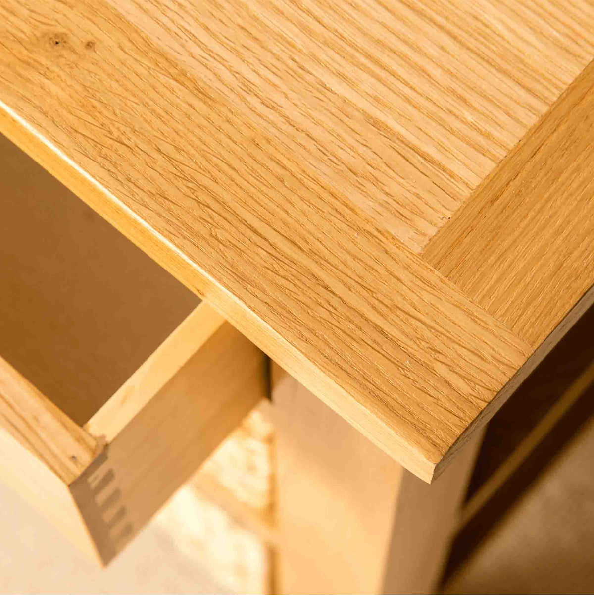 Close up of the top of a London Oak Hall Table with Baskets. 