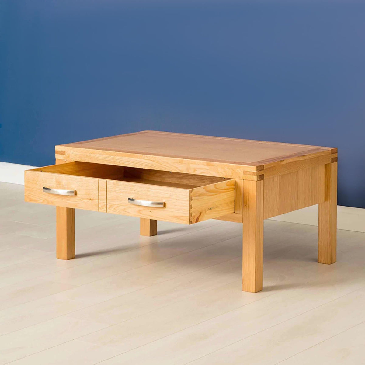 Abbey Light Oak Coffee Table - Lifestyle side view with drawer open
