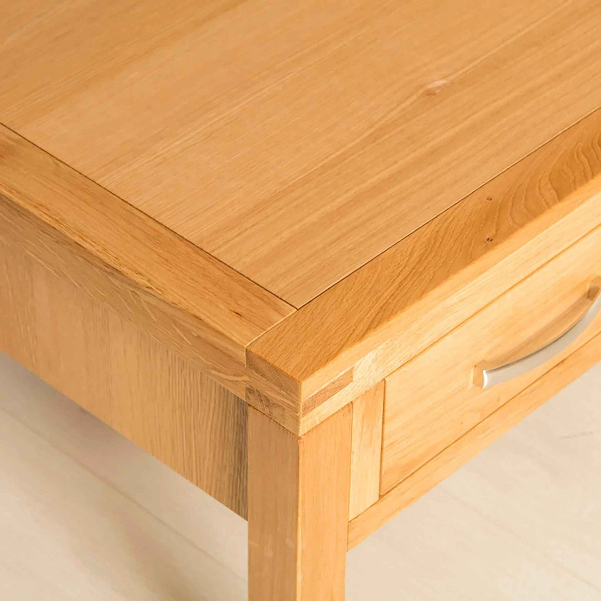 Topside corner view of the Abbey Light Oak Coffee Table with drawer from Roseland Furniture