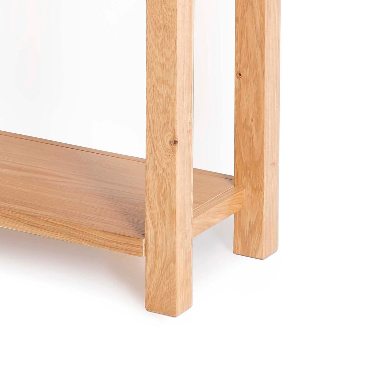 Abbey Light Oak Console Table - Close up of legs and lower shelf on console table