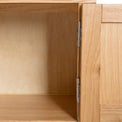 The Abbey Light Oak Large TV Stand - Close up of inside cupboard and hinges