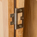 The Abbey Light Oak Large TV Stand - Close up of hinge