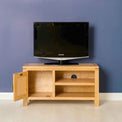 Abbey Light Oak 90cm TV Stand - Lifestyle front view with cupboard open