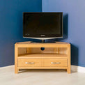 Abbey Light Oak Corner TV Stand - Lifestyle front view