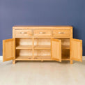 Abbey Light Oak Large Sideboard - Lifestyle Front view with cupboard doors open