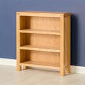 Abbey Light Oak Low Bookcase - Lifestyle side view