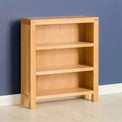 Abbey Light Oak Low Bookcase - Lifestyle side view