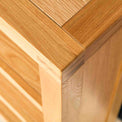 Topside corner view of the Abbey Light Oak Low Bookcase by Roseland Furniture
