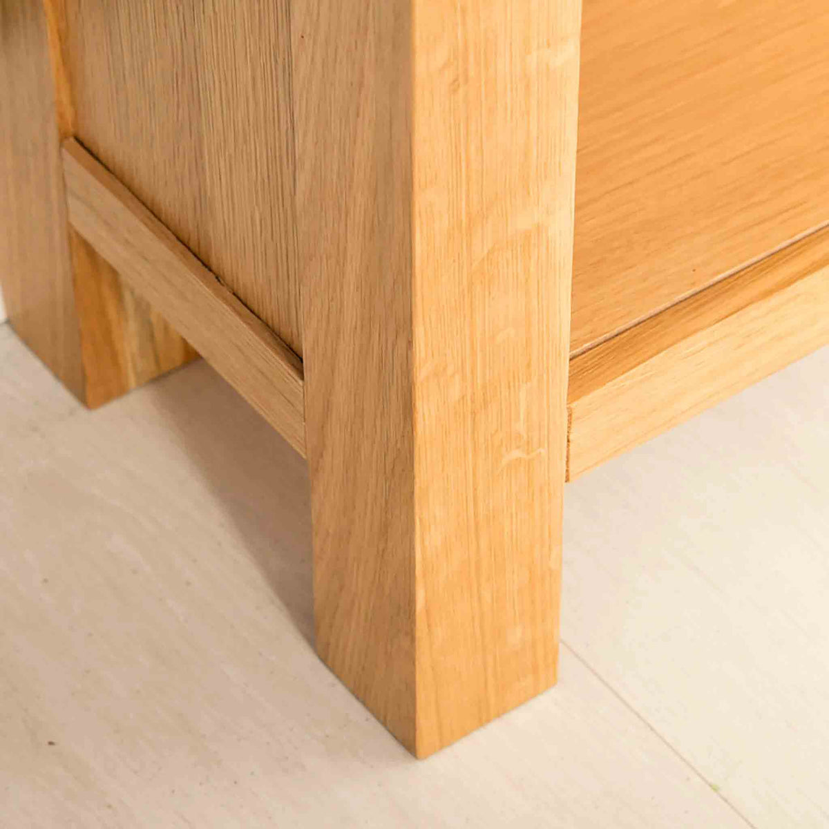 Leg view of the Abbey Light Oak Small Bookcase by Roseland Furniture