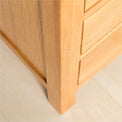 Leg view of the Abbey Light Oak Bedside Table by Roseland Furniture