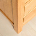 Leg view of the Abbey Light Oak Bedside Table by Roseland Furniture