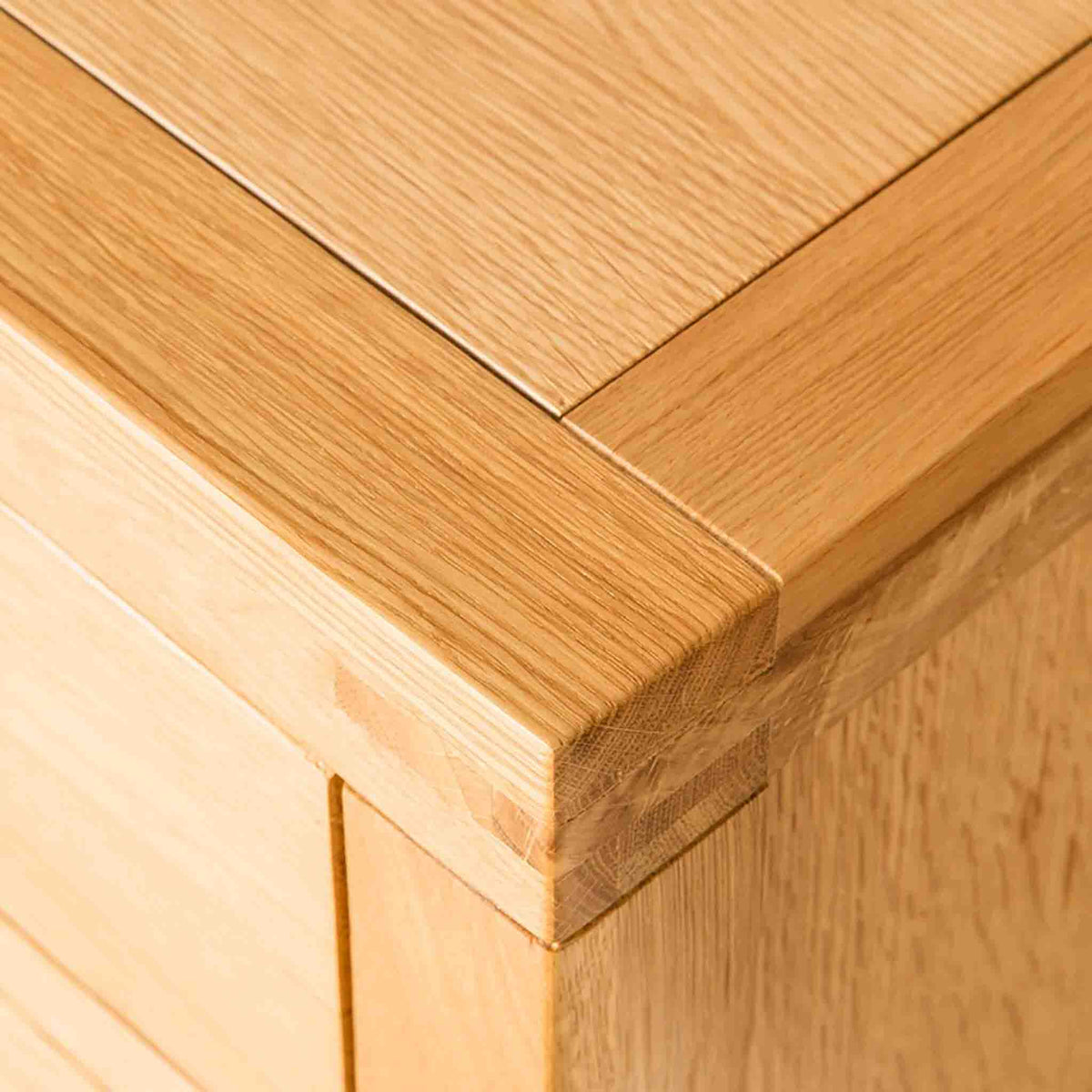 Topside corner view of the Abbey Light Solid Oak Chest of Drawers by Roseland Furniture