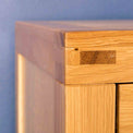 Corner view of the Abbey Light Oak Chest of Drawers by Roseland Furniture