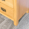 Surrey Oak waxed 4 drawer chest of drawers - Close up of foot