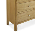 Alba Oak 6 Drawer Chest of Drawers - Close up of feet on chest of drawer