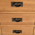 close up of drawer drop down handles on the Surrey Oak 3 Drawer Sideboard by Roseland Furniture
