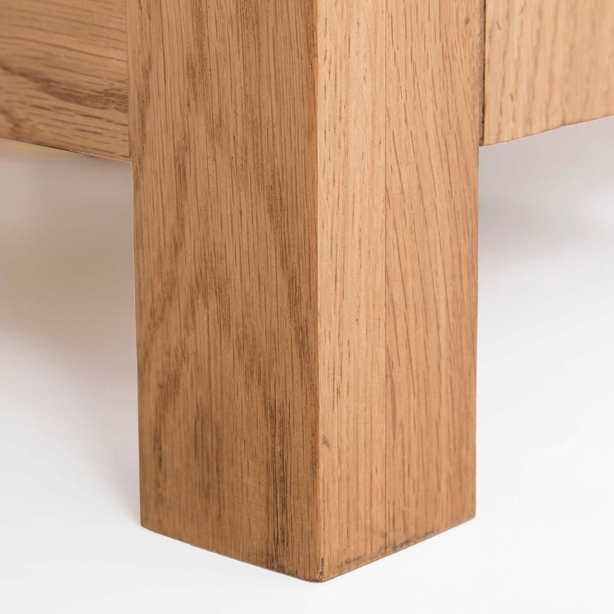 close up of the solid wood leg on the Surrey Oak 3 Drawer Sideboard