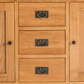 central drawers on the Surrey Oak 3 Drawer Sideboard by Roseland Furniture