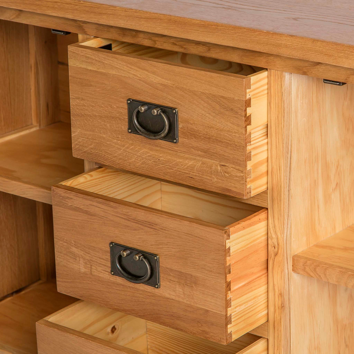 opened drawer view on the Surrey Oak 3 Drawer Sideboard by Roseland Furniture