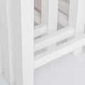 close up of the solid wood legs on the Farrow White Nest of Tables