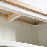 under view of the oak top on the Farrow White Low Bookcase 
