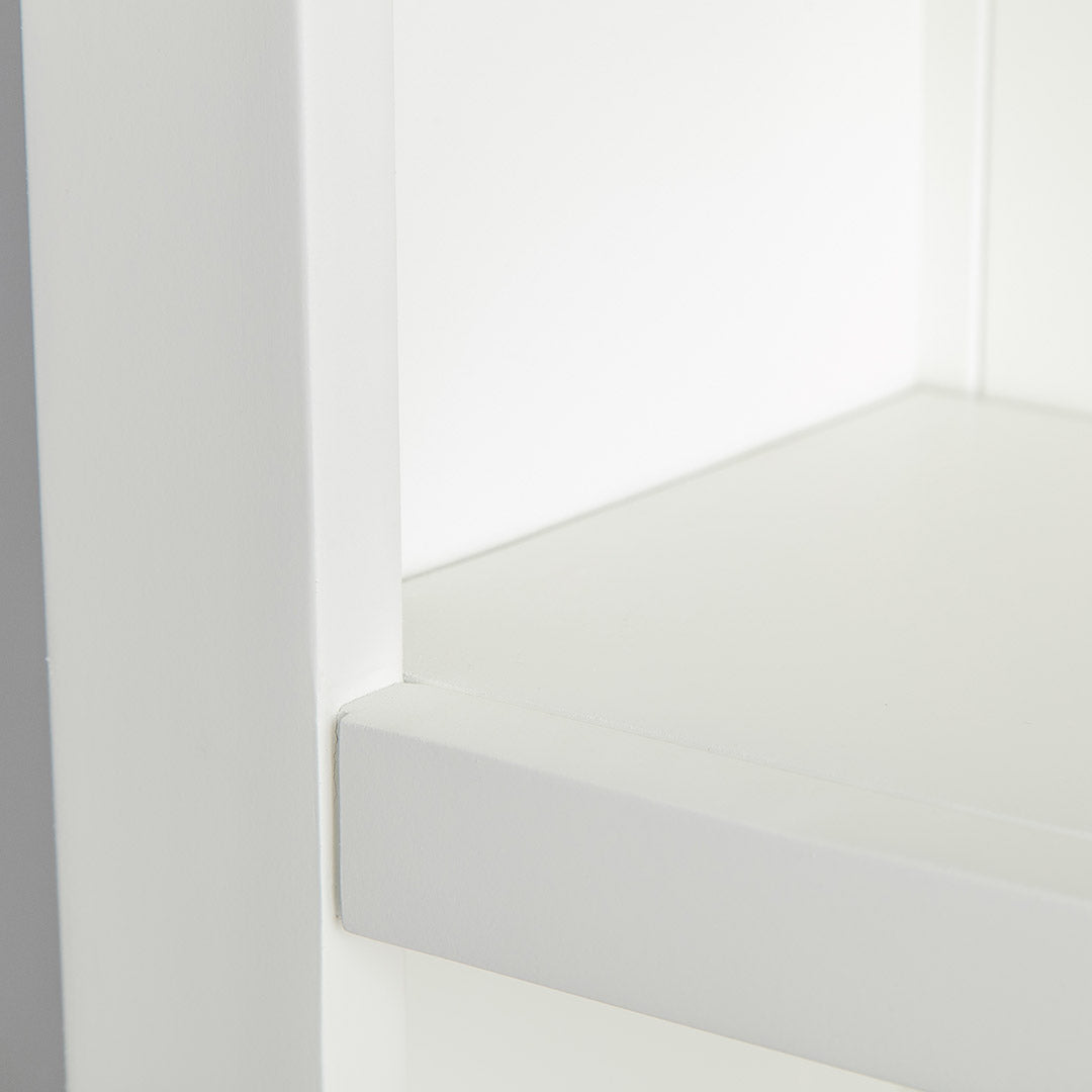 Close up of the white wooden frame on the Farrow White Large Bookcase