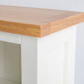 Close up of the oak top on the Farrow White Narrow Bookcase