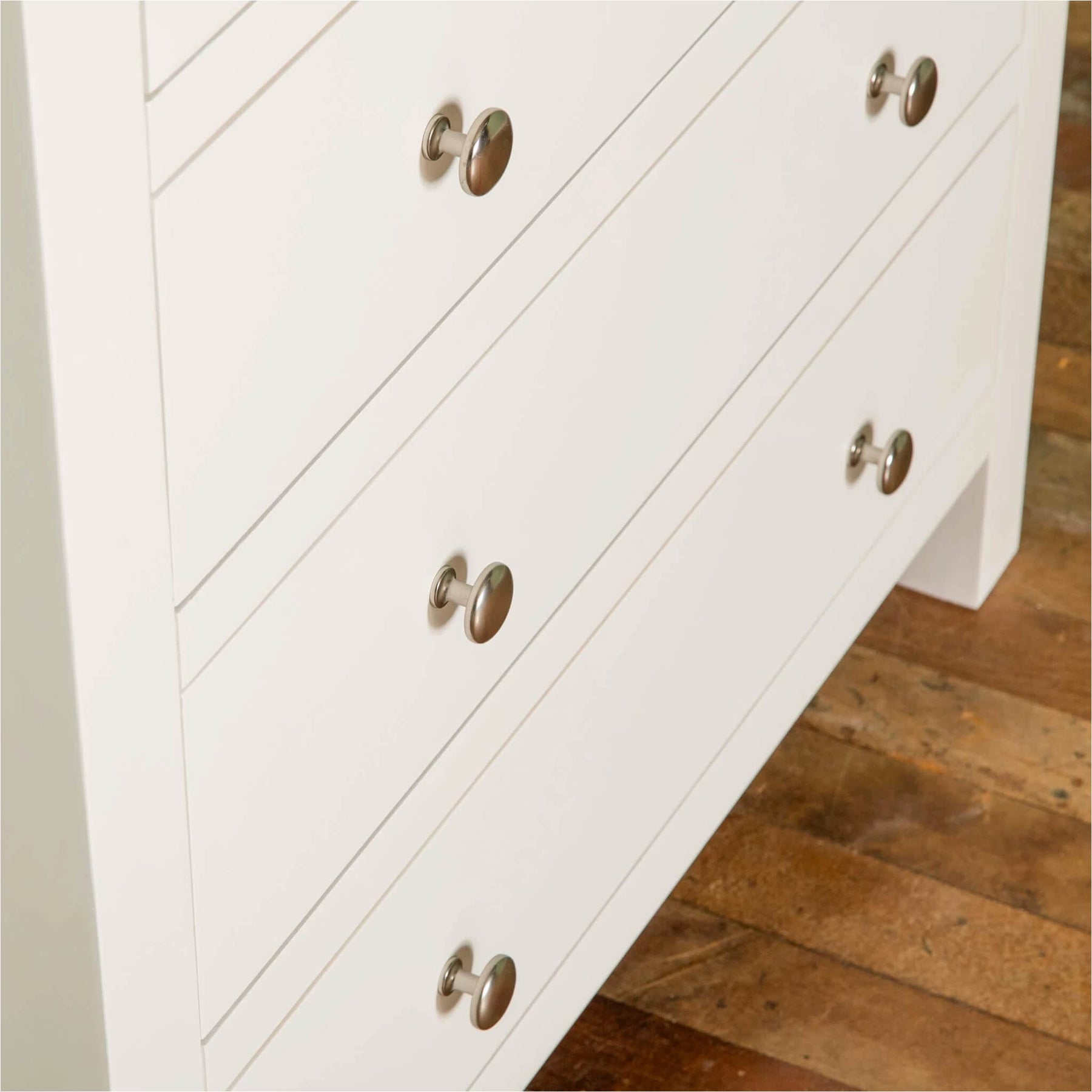 Farrow White 2 Over 3 Chest Of Drawers from Roseland Furniture - close up of drawers