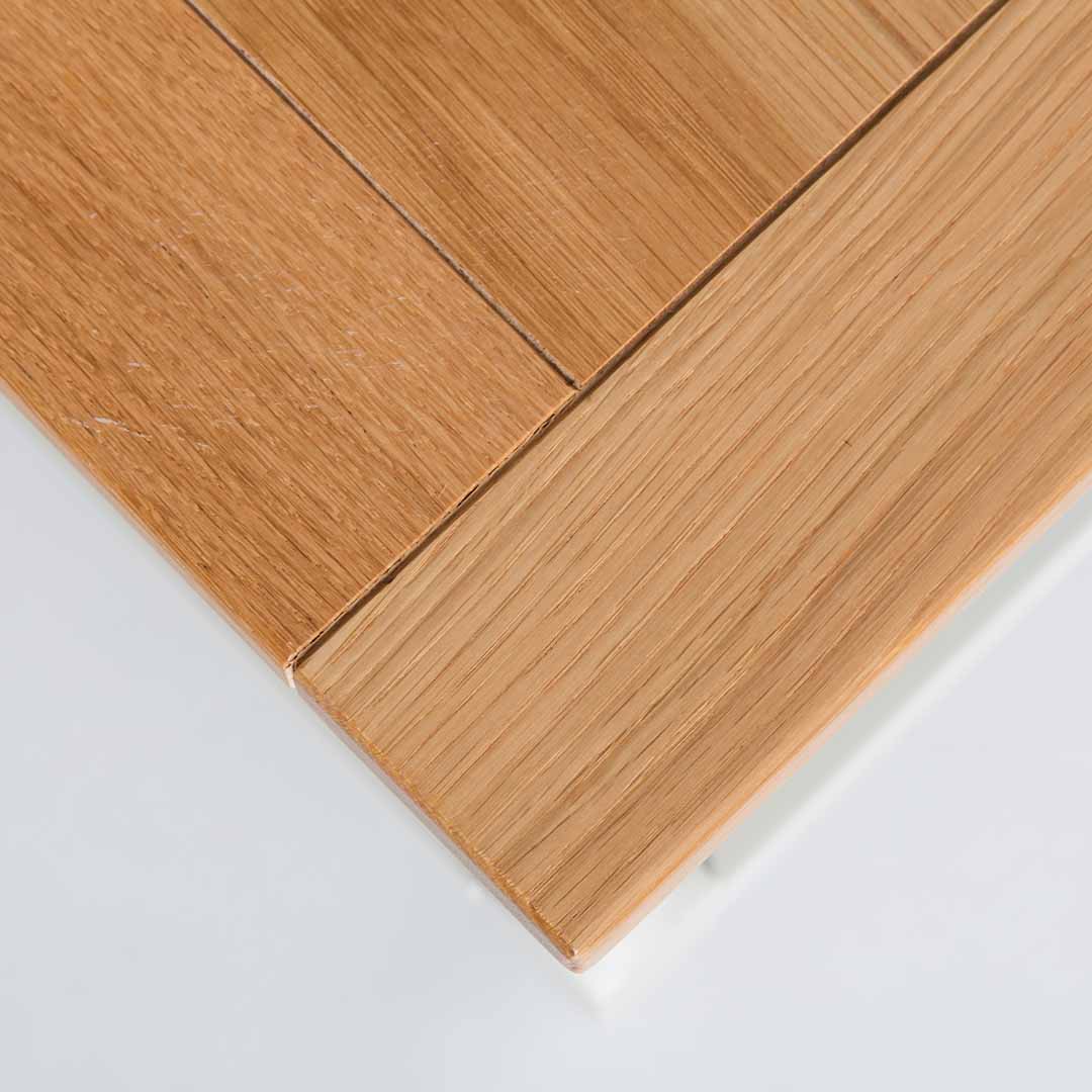 Close up of the oak top corner on the Chichester Ivory Coffee Table