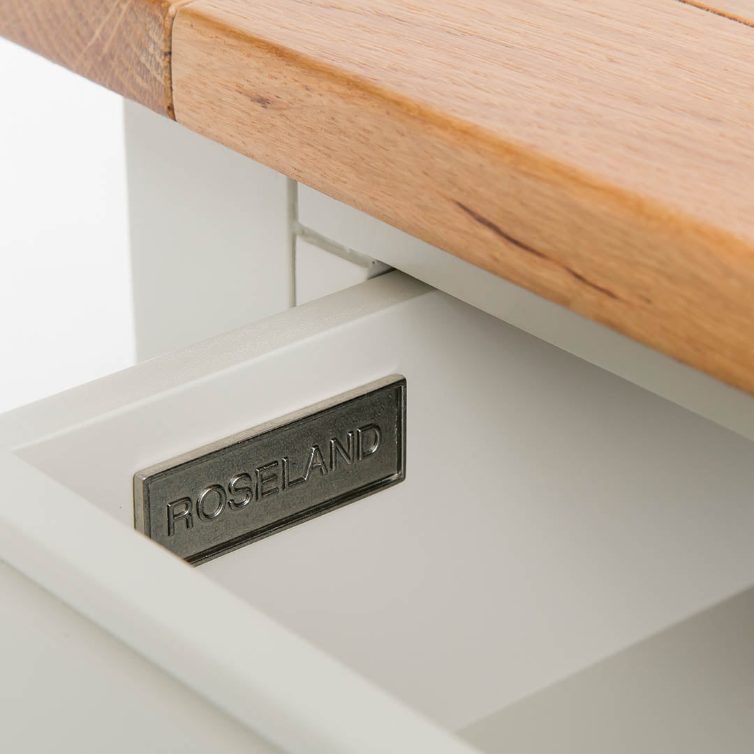 Close up of the metal Roseland drawer label on the Chichester Ivory Coffee Table